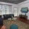 a living room with a large window and tv
