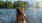a dog playing in a body of water