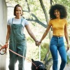 a couple walking a dog together