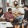 a group hanging out in living room with guitar