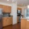a kitchen with wooden cabinets